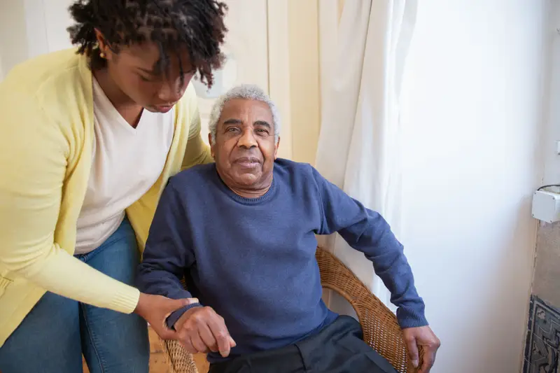 A caregiver with an older man